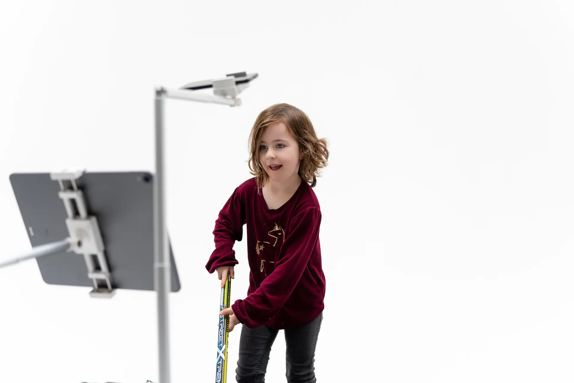 Agnes playing Odd Man Rush with a hockey stick